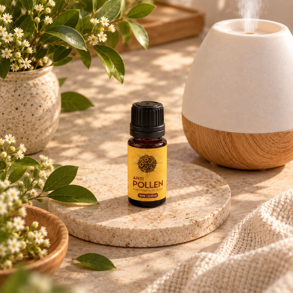 Anti Pollen blend bottle on a stone coaster beside a diffuser