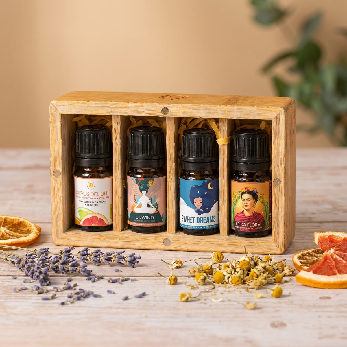 Calming essential oil blend set in a wooden box with dried lavender, chamomile and orange slices