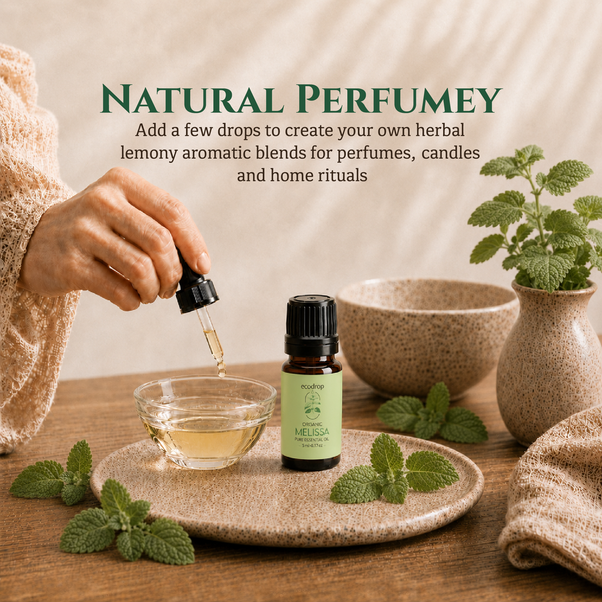Adding drops of Melissa lemon balm oil to a glass bowl to make a herbal perfume blend