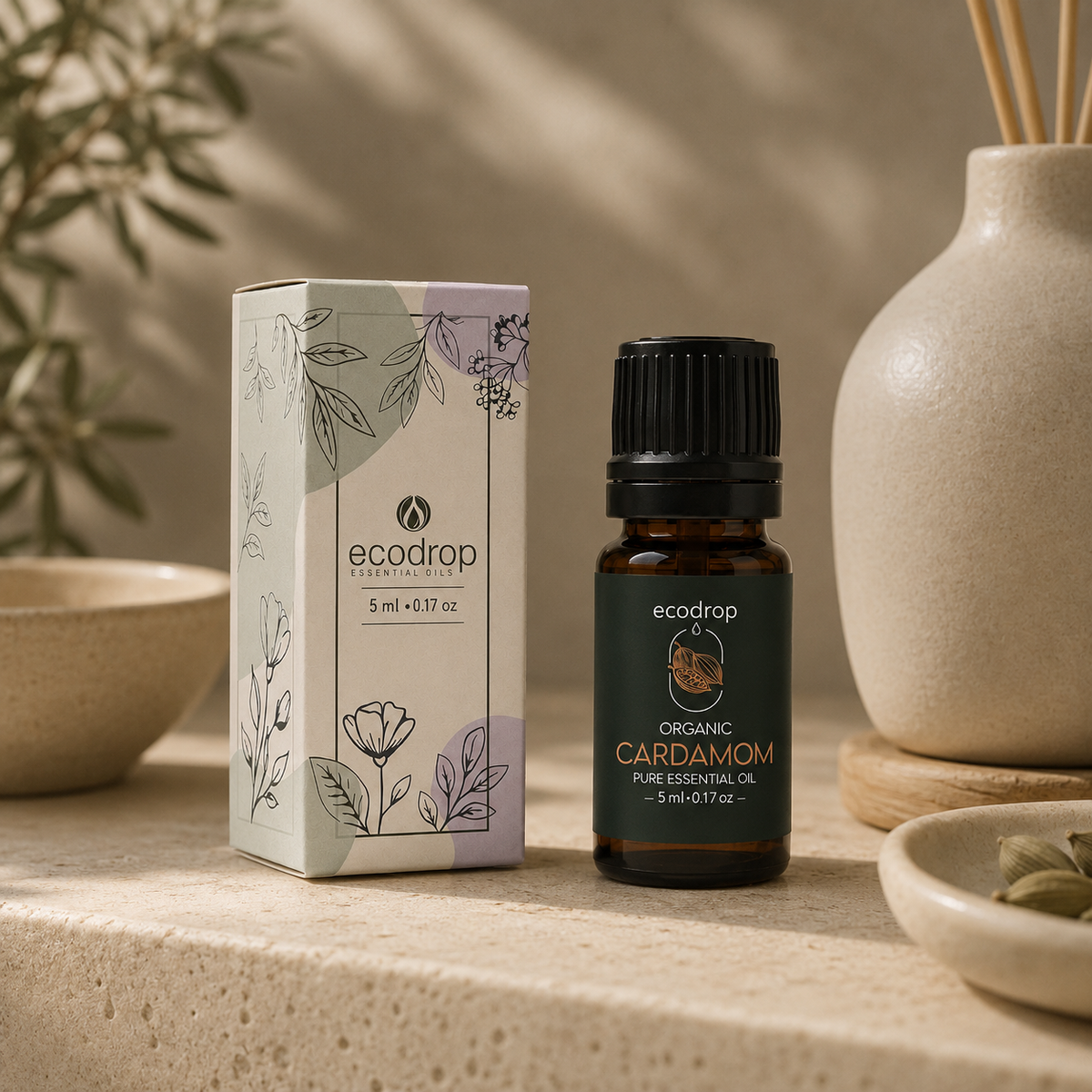 Organic cardamom oil 5ml bottle with its Ecodrop gift box and green cardamom pods