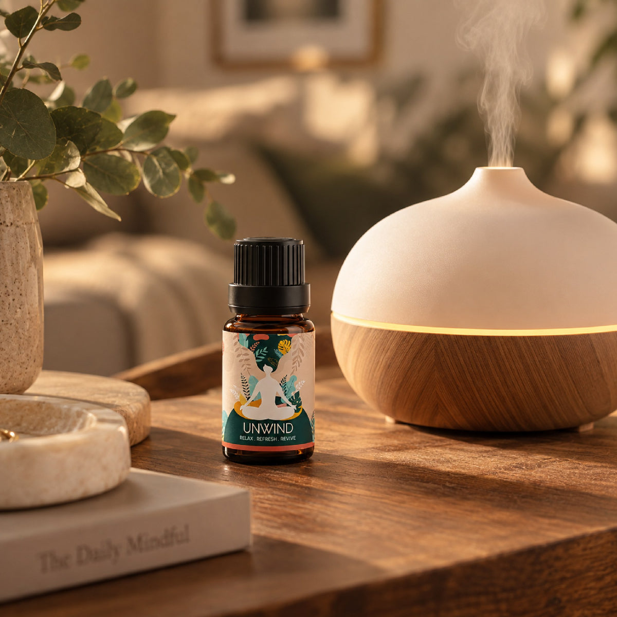 Unwind blend on a wooden table beside a glowing diffuser