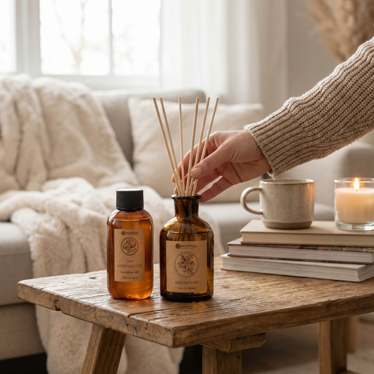 Coco Sandalwood reed diffuser styled on a wooden table in a cosy living room
