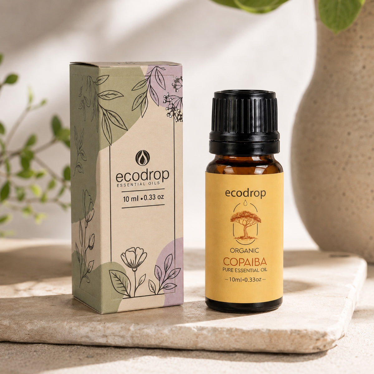 Organic copaiba balsam bottle with its Ecodrop box and copaiba resin