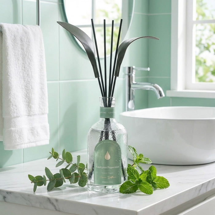 Eucalyptus & Peppermint reed diffuser styled on a bathroom vanity