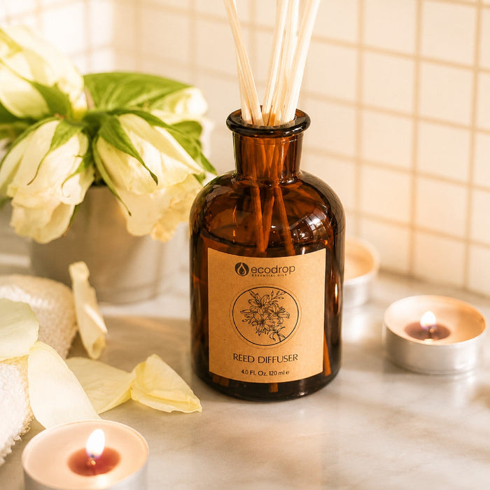 Rose Absolute reed diffuser styled on a bathroom counter with flowers and candles