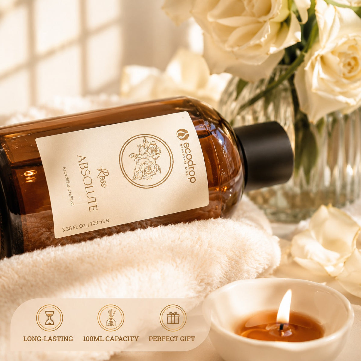 Rose Absolute reed diffuser refill oil bottle styled with white roses and a candle