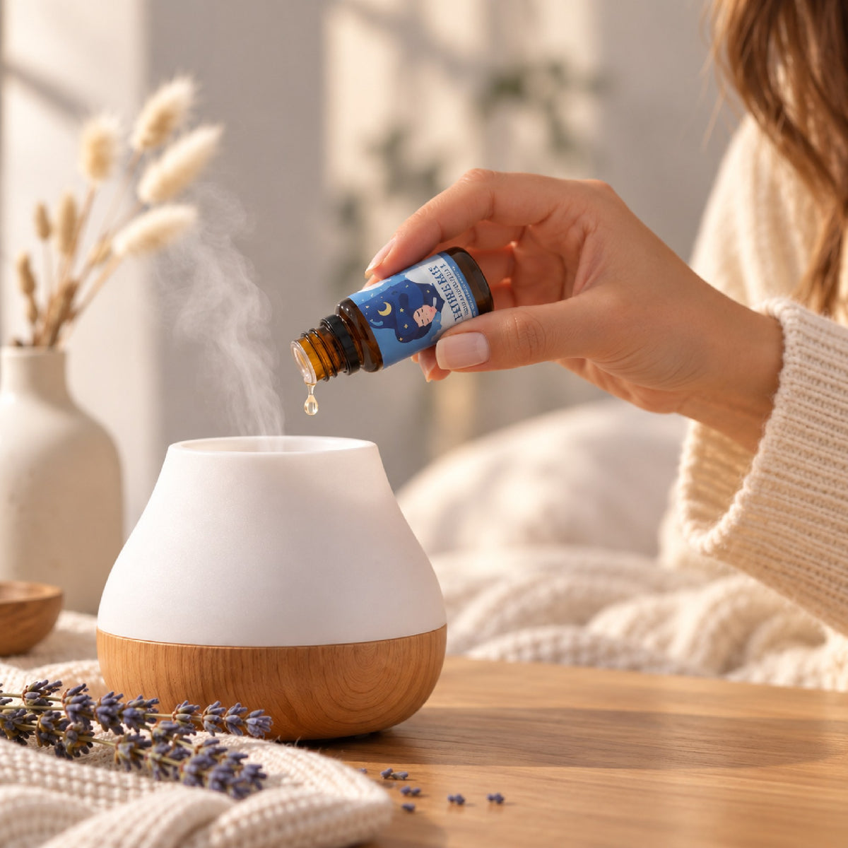 Drops of Sweet Dreams blend going into a bedside diffuser