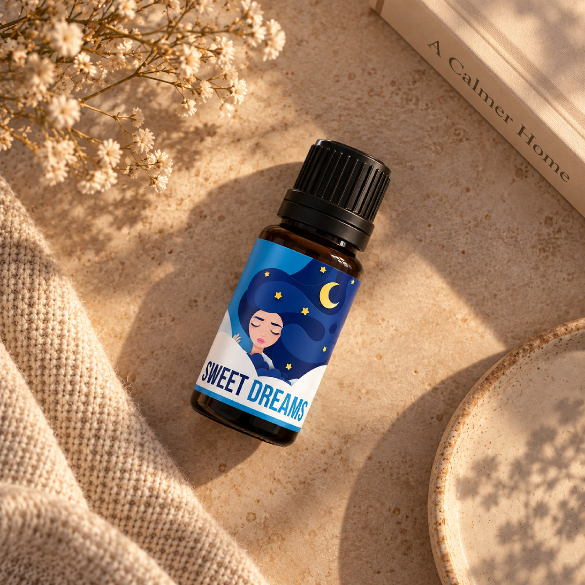Sweet Dreams essential oil blend on a soft blanket at bedtime
